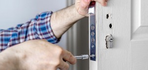 locksmith replacing an entire door lock