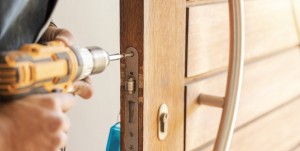 emergency locksmith in Sydney changing a lock on home door